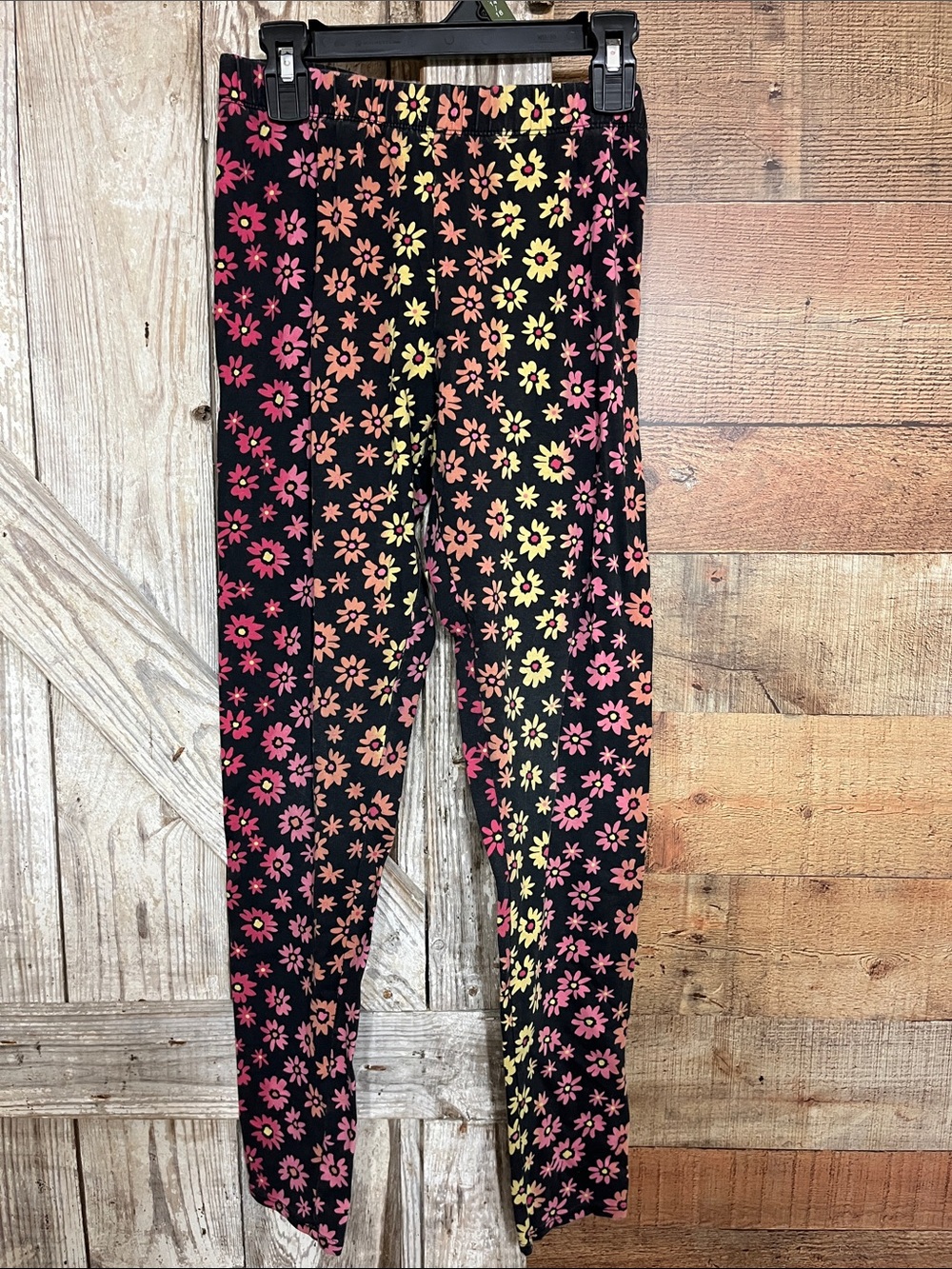 No Boundaries Black Leggings with Pink, Orange and Yellow Daisy Pattern